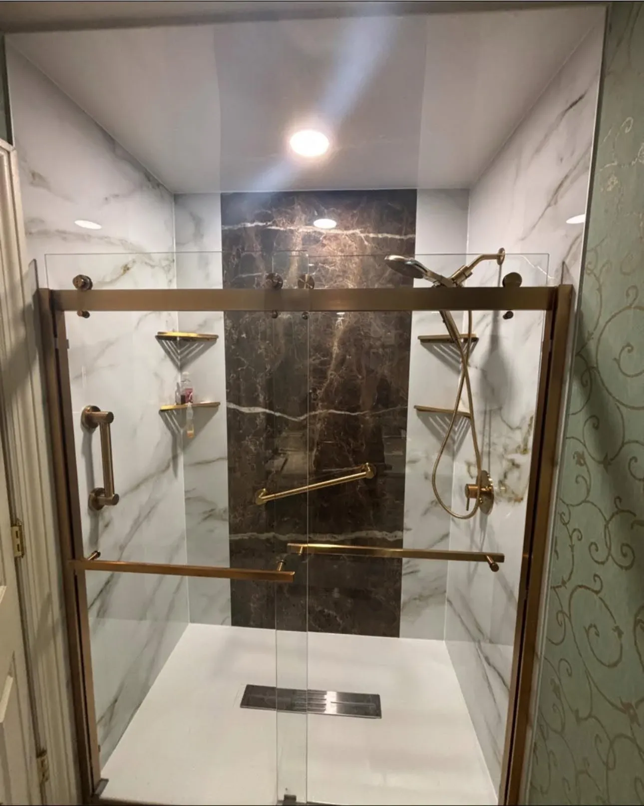 Walk-in shower with Aries Desert walls featuring warm, natural tones and sleek modern design.