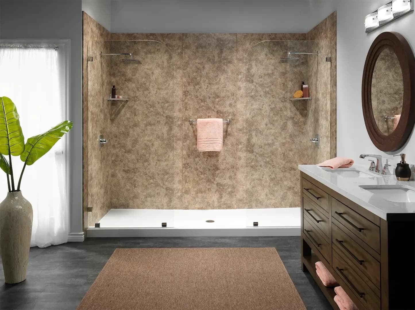 A walk-in shower with glass walls and a textured back.