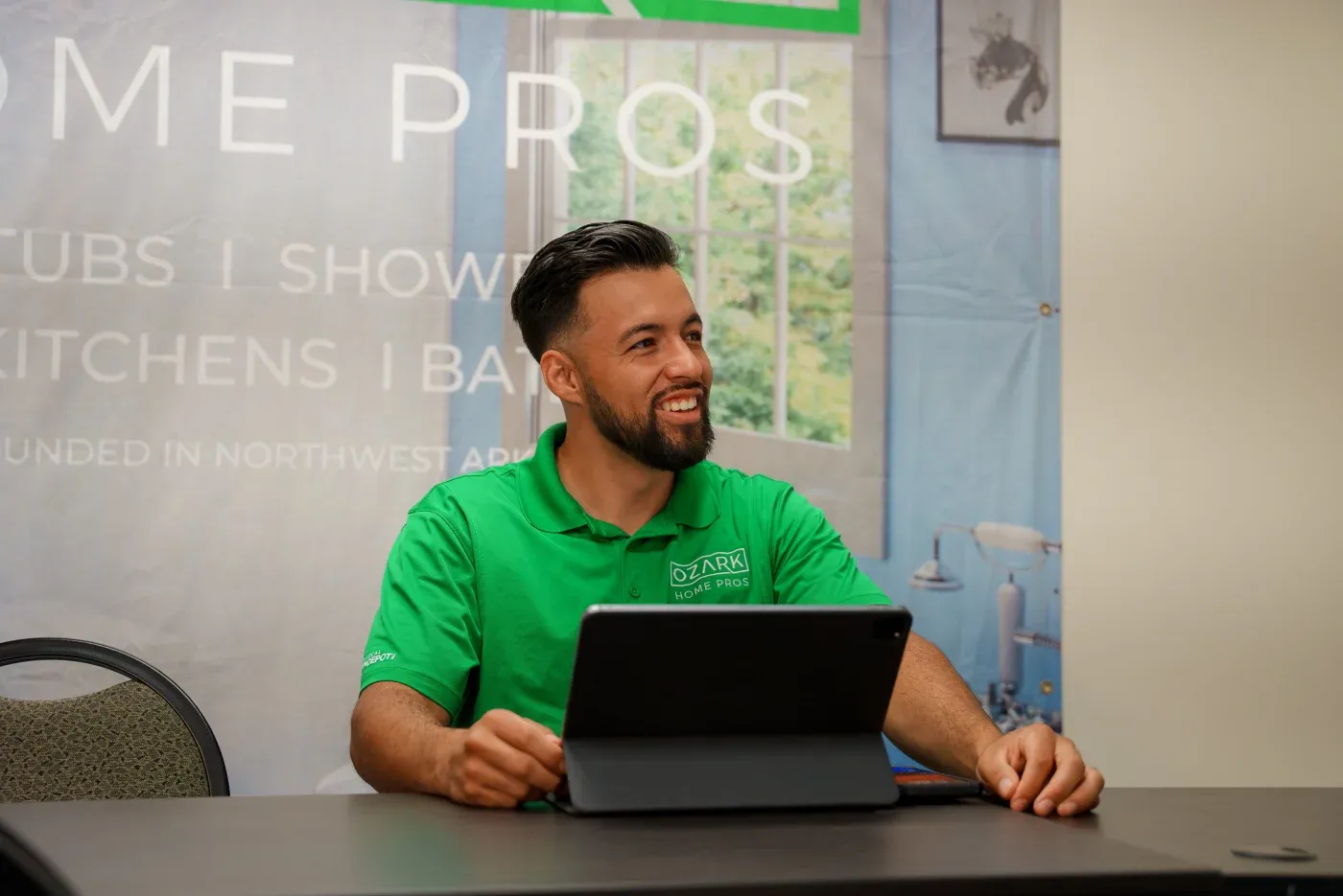 The Founder & CEO of Ozark Home Pros, Eric Parker, demonstrating to a homeowner how one of their high-quality replacement windows functions wearing a great company t-shirt.