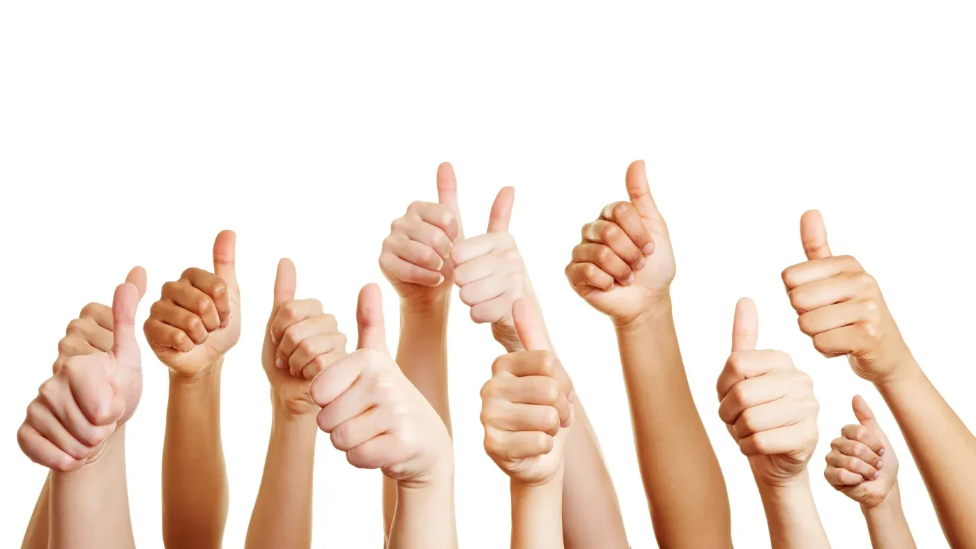 Many people give thumbs up.